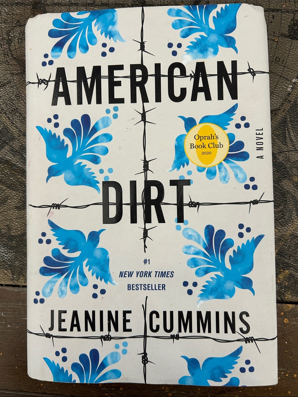 American Dirt by Jeanine Cummins - White & Blue Cover